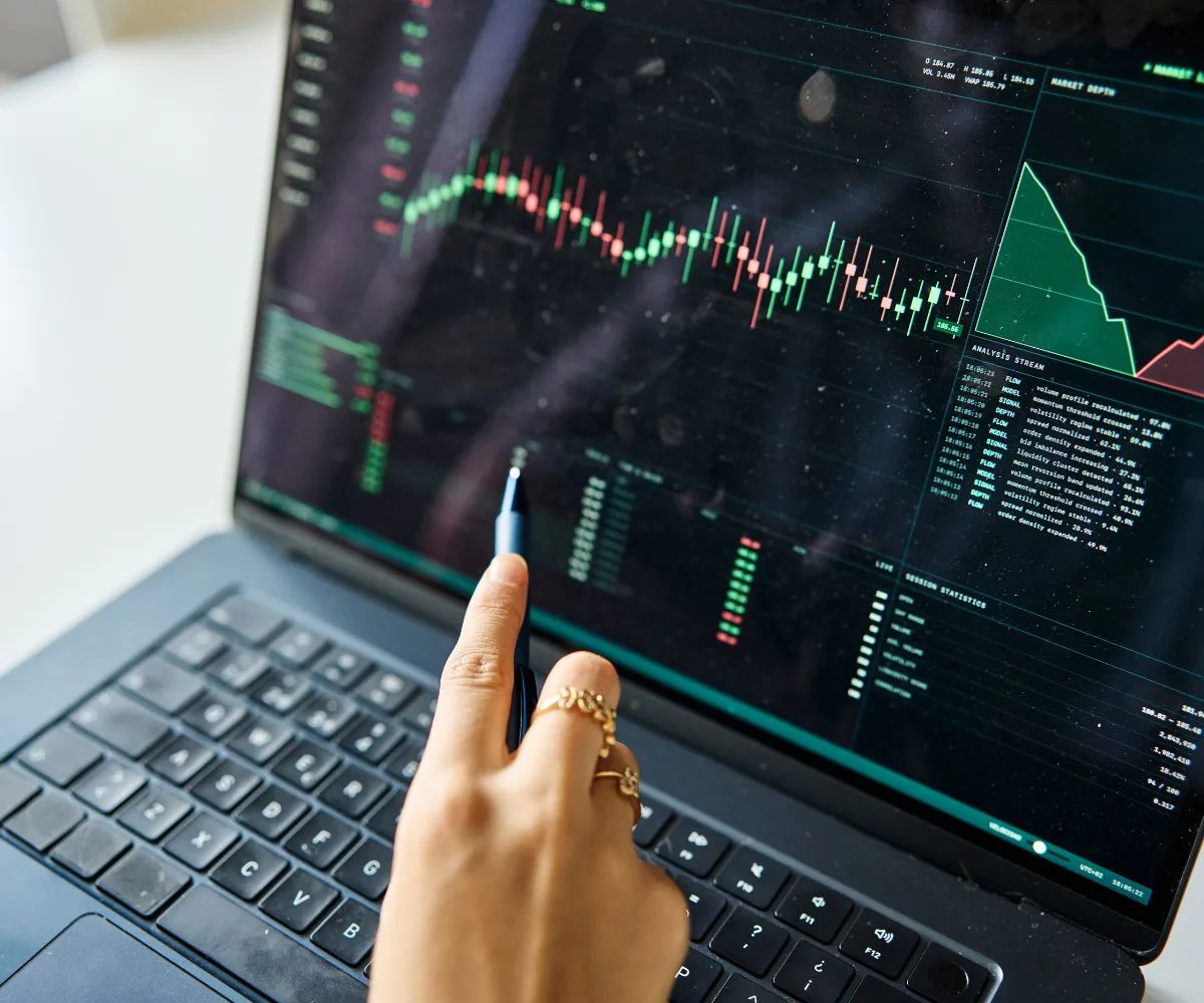 Analyst reviewing a business risk assessment on a laptop