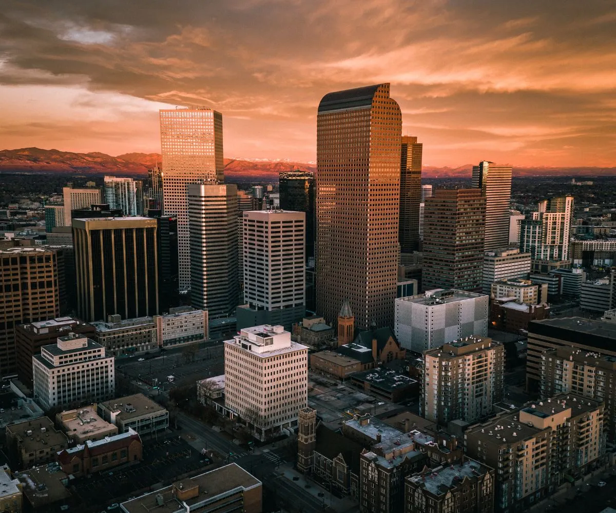 Business consultant meeting a founder with a city skyline in the background