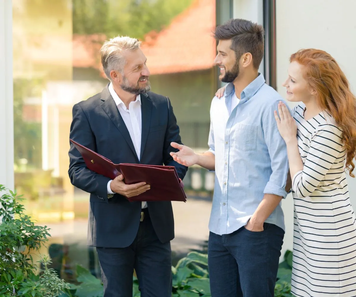 GMS management consultants reviewing business reports and charts with a client