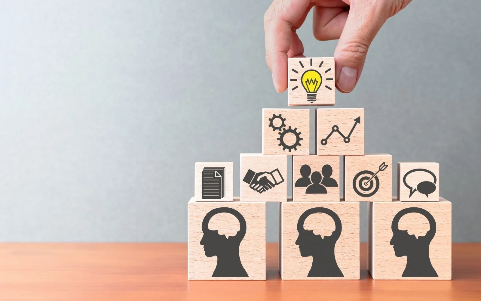 Management consultant discussing business strategy with a team at a meeting table