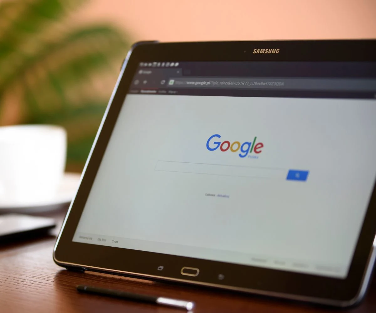 Google Ads and Meta Ads logos on a laptop screen